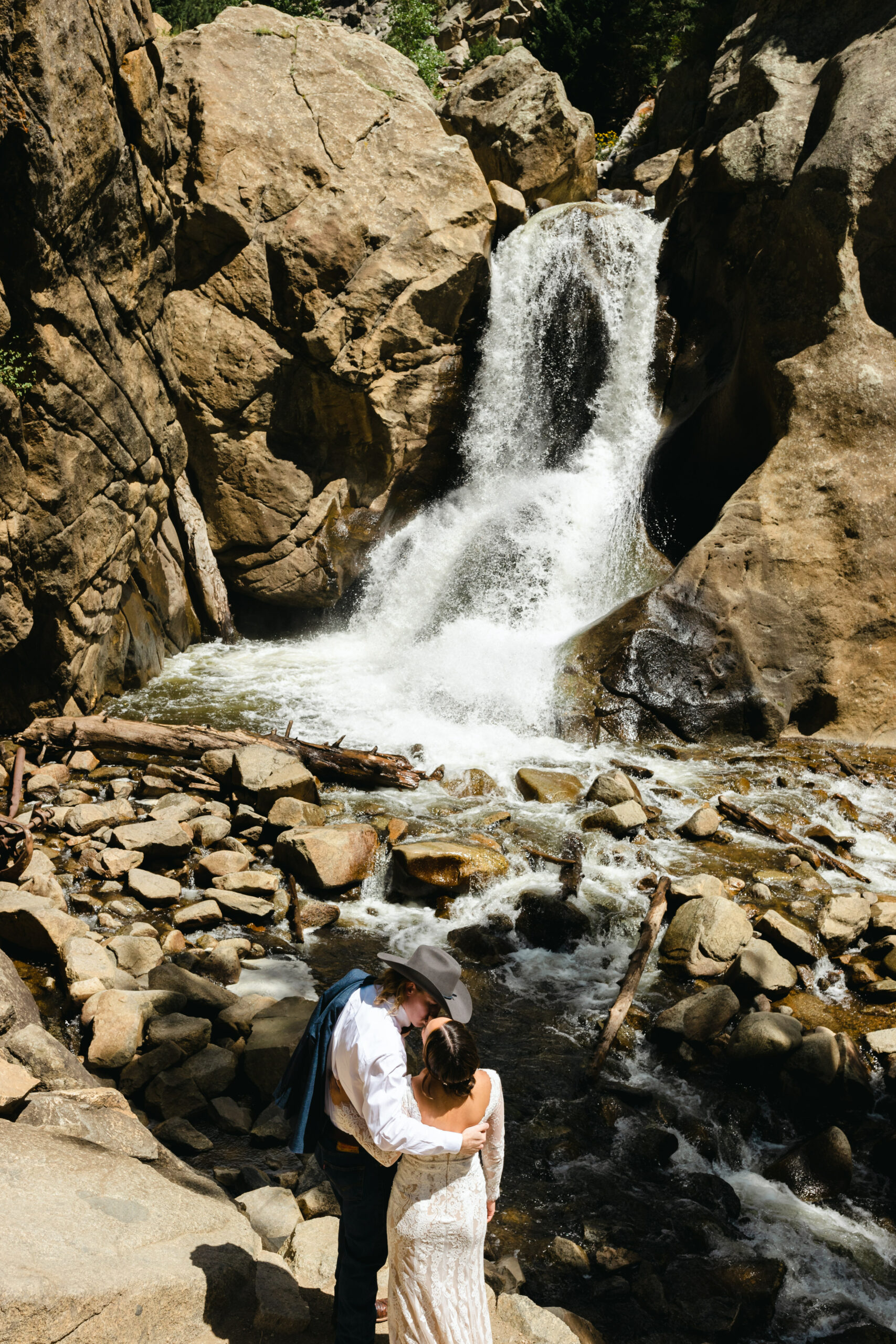 couple kissing at waterfall