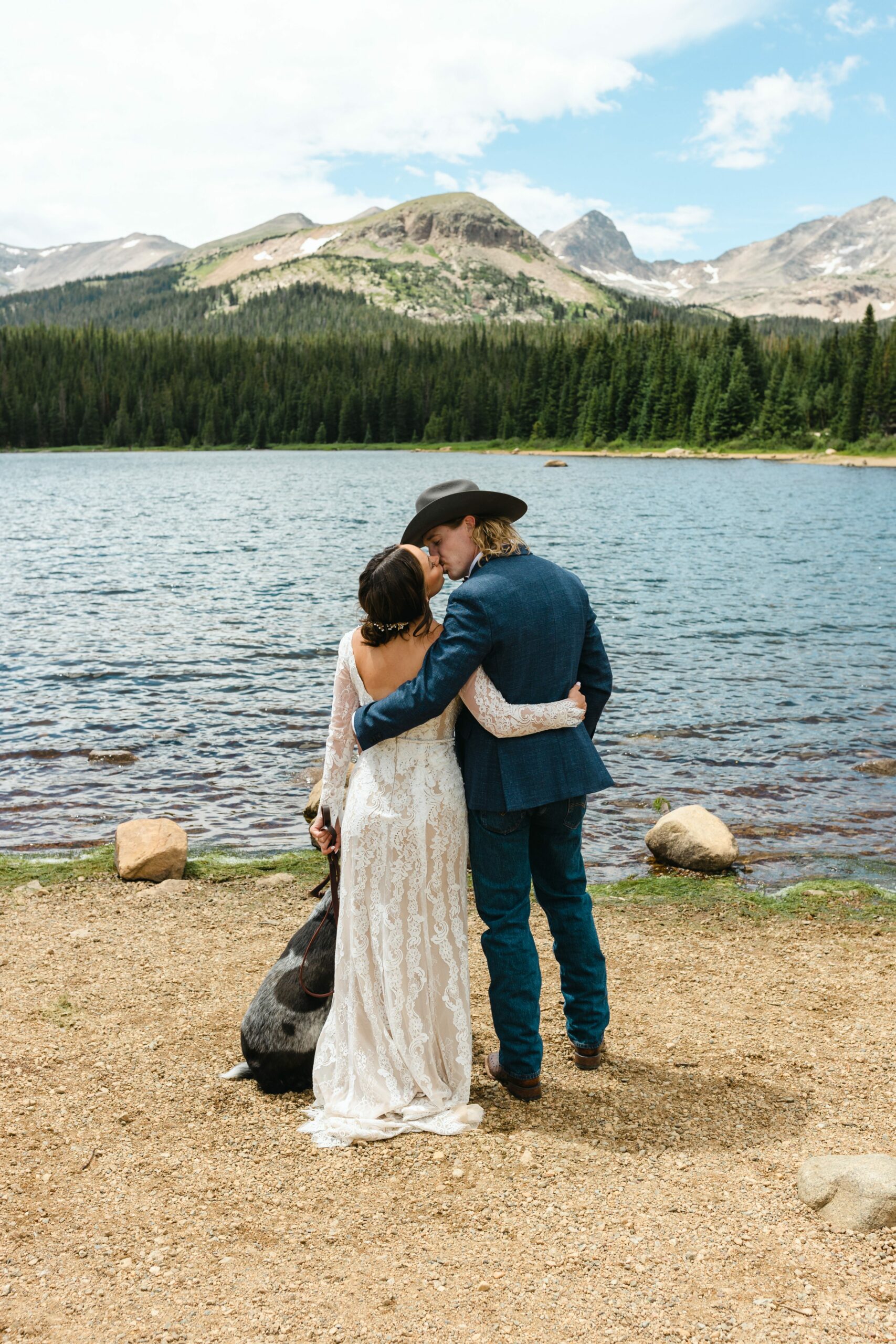 couple kissing at alpine lake