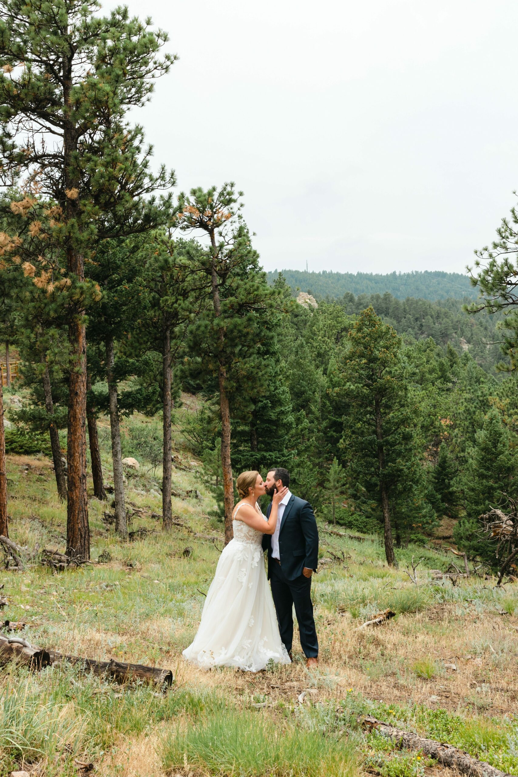 bride and groom kissing in colorado