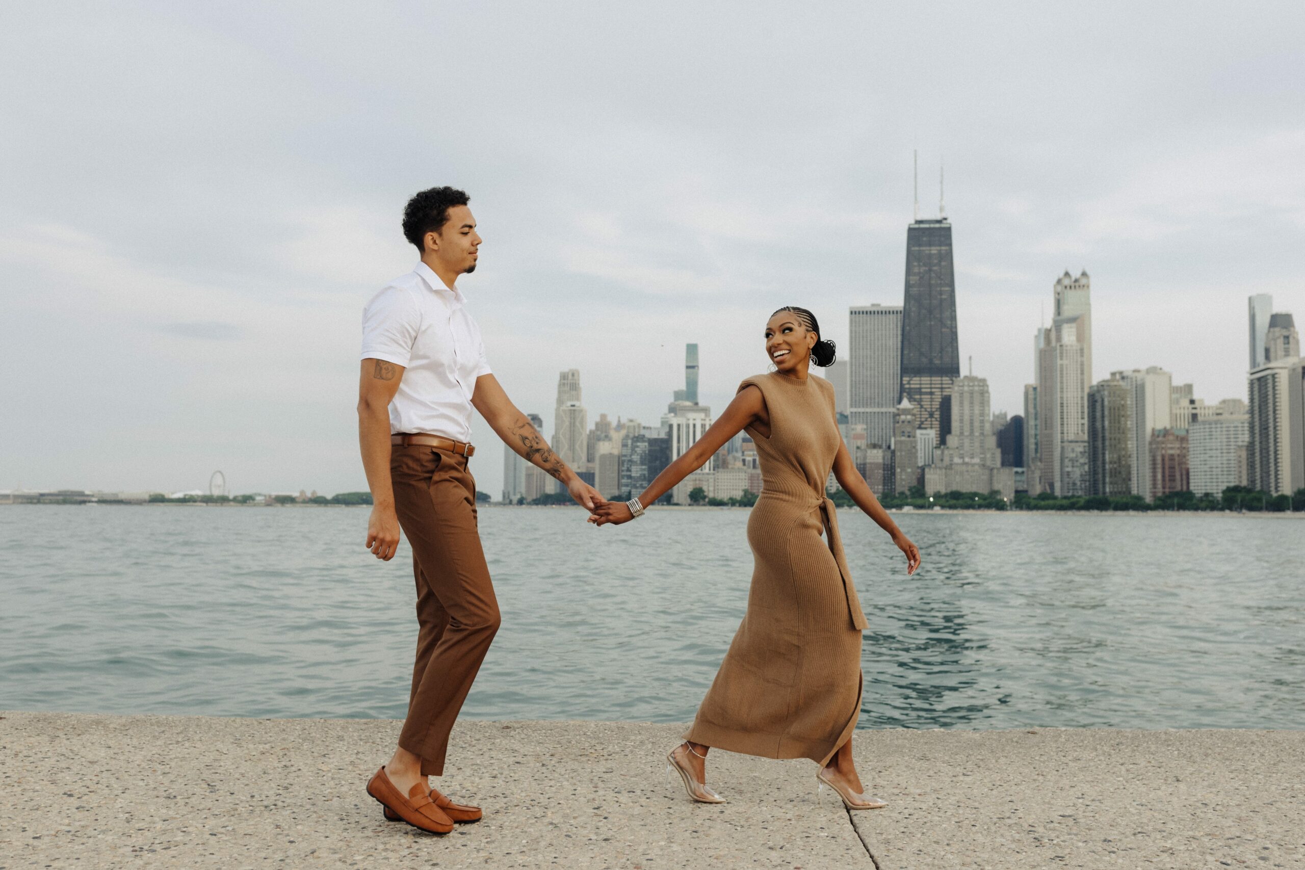 couple walking in front of chicago skyline