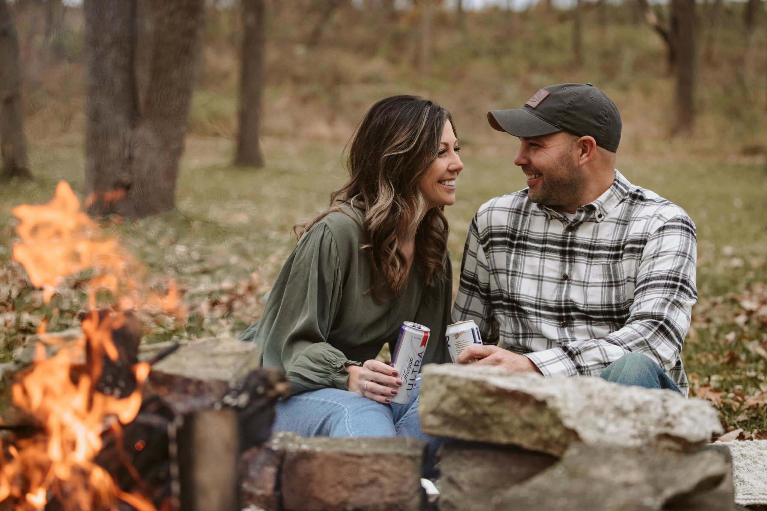 engagement photos around campfire